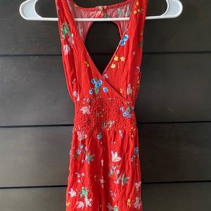 Holister V neck red floral romper size small with open back